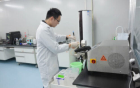 Researcher working in a biosafety cabinet